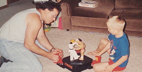 Billy Eshleman and his father with a toy A retro image of Hemophilia A patient, Billy Eshleman, and his father sitting on the ground playing with a toy.