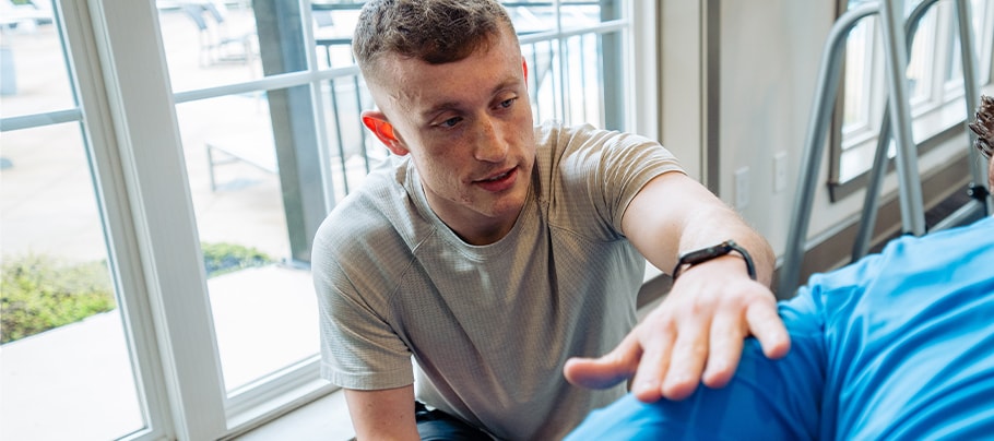 Hemophilia A patient, Zach Mullins, training with a client Hemophilia A patient, Zach Mullins, training with a client