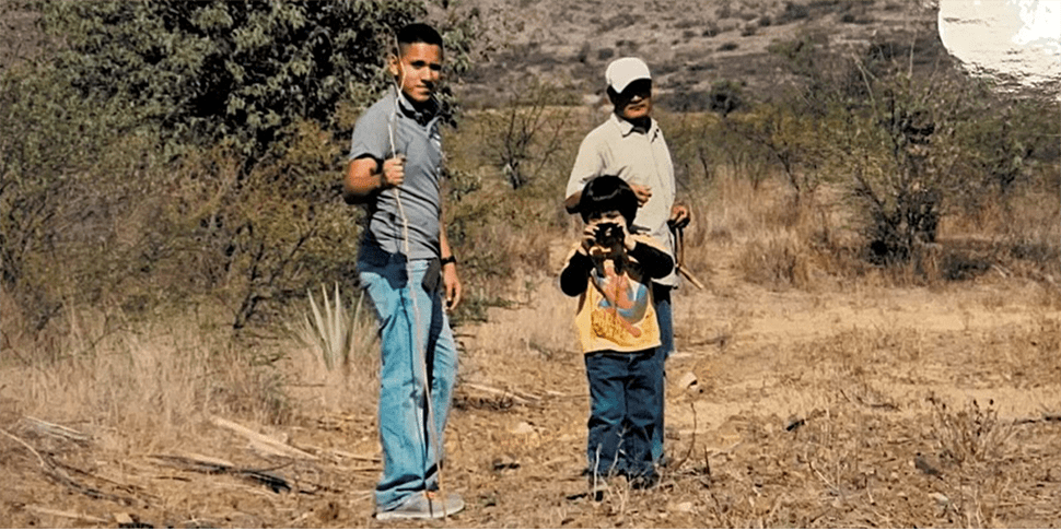 Hemophilia A patient, Daniel Cruz, hiking with his family Hemophilia A Patient, Daniel Cruz, holding a stick and hiking with his brother and father