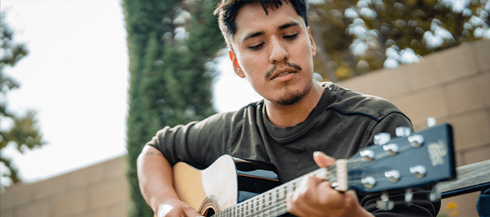 Hemophilia A patient, Daniel Cruz, playing guitar Hemophilia A patient, Daniel Cruz, playing guitar