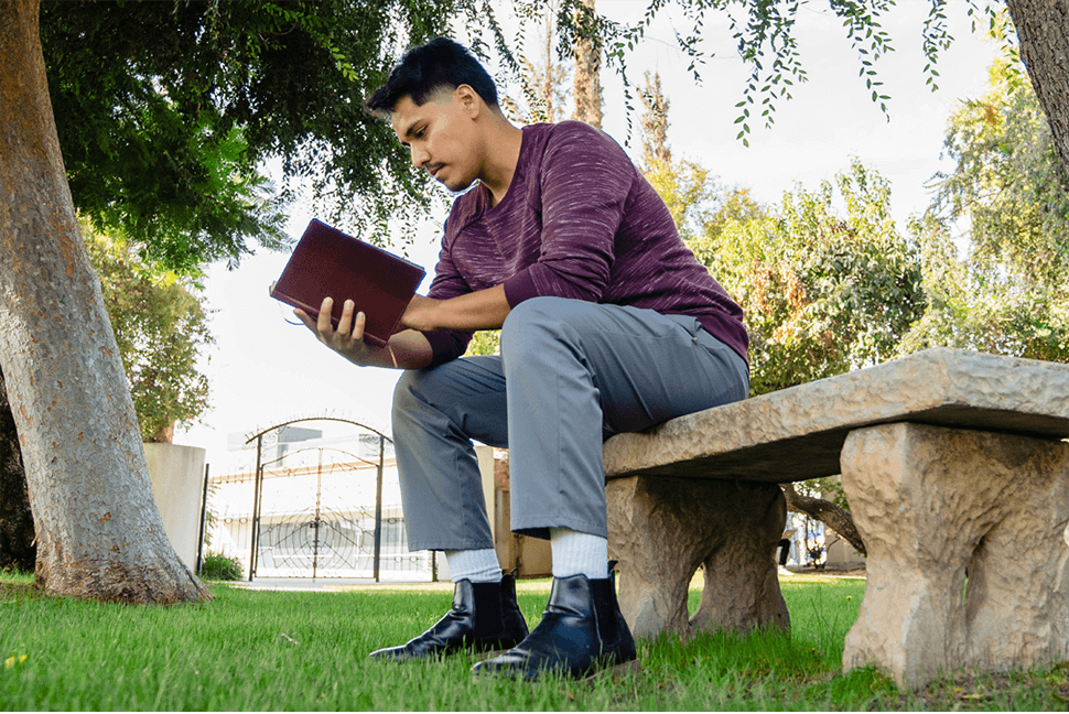 Hemophilia A patient, Daniel Cruz, Reading Book Hemophilia A patient, Daniel Cruz, reading a book on a bench